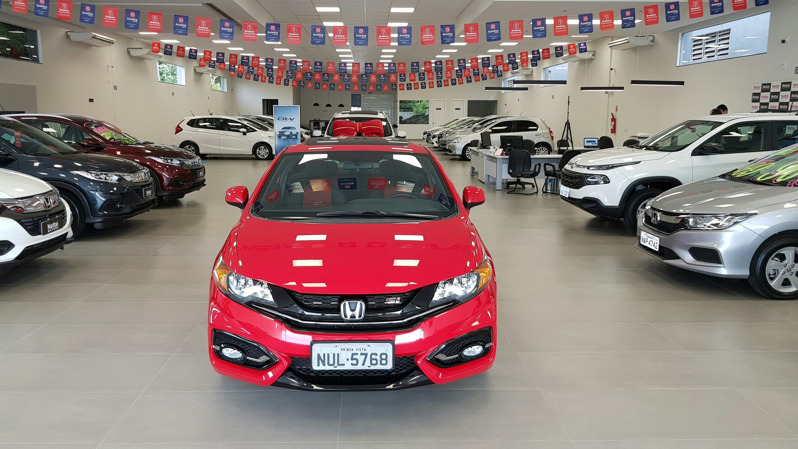 red car in a no haggle dealership